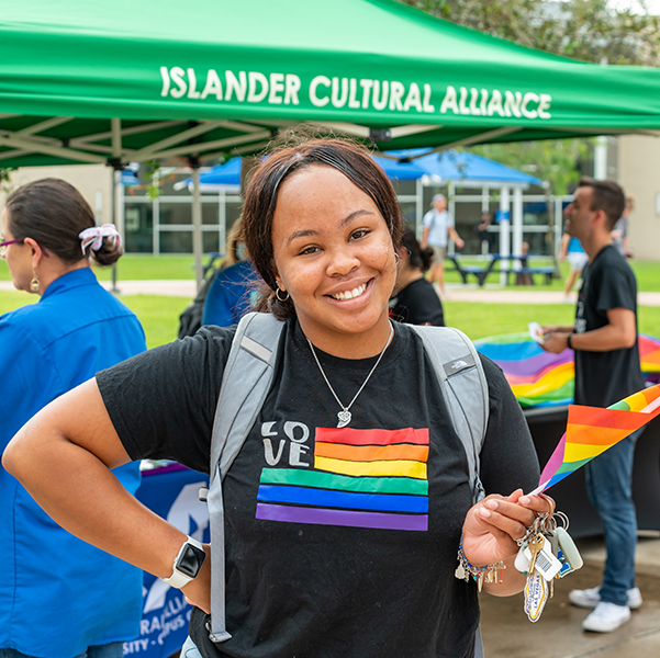 girl holding pride flag